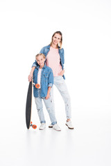 Fototapeta premium daughter and mother with longboard