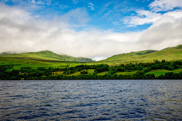 Green grass hills slopes landscape at Loch Tay in central Scotland