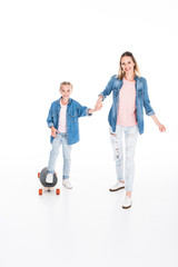 Fototapeta premium daughter skateboarding on longboard