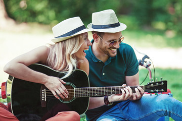Love Couple Enjoying Guitar in the Park