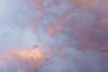 view on the beautiful blue orange evening sunset sky with clouds.