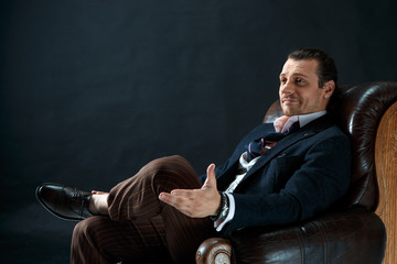 Businessman sitting on an armchair