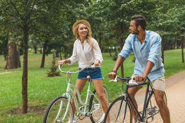 Fototapeta na wymiar happy couple riding bicycles