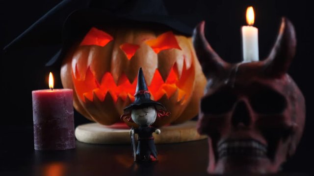 Halloween. Pumpkin, skull, witch, candle. Static camera