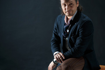 Businessman sitting on an armchair