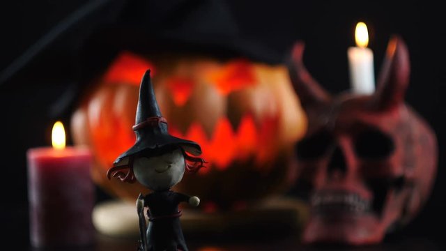 Halloween. Pumpkin, skull, candle, witch. Focus changes