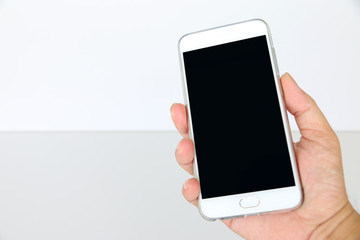 Smartphone in hand with space for your text.