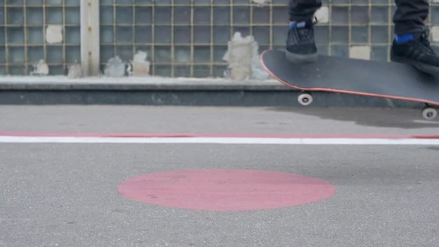 Young Skater Doing Nollie Heelflip Trick in Slow Motion. Close up Skateboarding Footage in 180fps, HD.