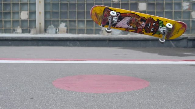 Skater Doing Nollie Heelflip Trick in Slow Motion. Close up Skateboarding Footage in 180fps, HD.