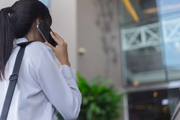 modern business woman working with smartphone outdoor