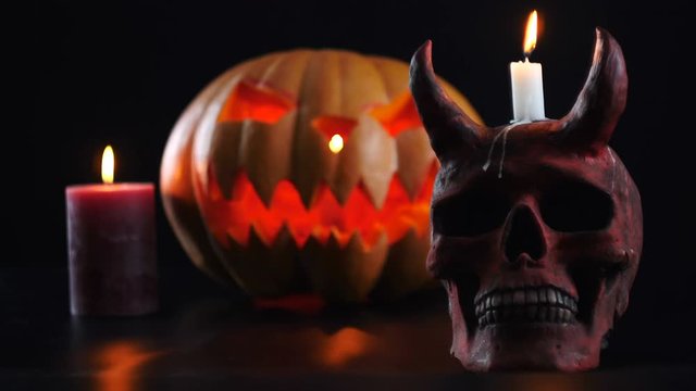 Halloween. Pumpkin, skull, candle, witch. Change of focus