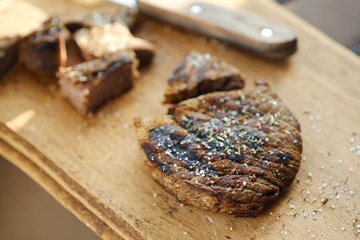 Tasty fresh grilled meats with spices and salt