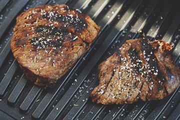 Tasty fresh grilled meats with spices and salt