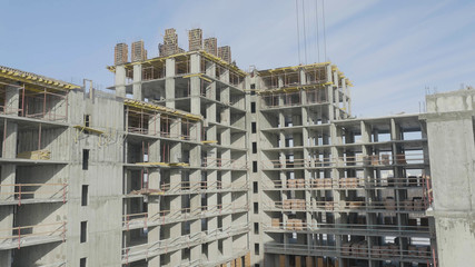 Apartments construction site with crane. Crane and building construction