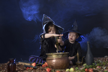 two halloween witches cooking a potion