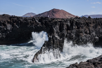 Big waves breaking on rocks