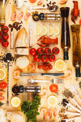 Silverware with spices, cherry tomatoes and cancers