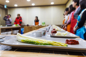 People learn how to make kimchi.