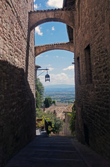 Obraz premium Medieval Street of Assisi and landdcsape of Umbria