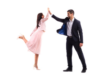 Young man and woman on an isolated white background hit each other on the hands - gesture for five...