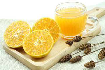 Fresh orange juice with orange fruits isolated on white background