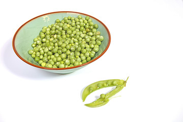 Fresh peas in pod and bowl