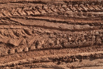 tire track of many vehicle on soil mud road in countryside in rainy season