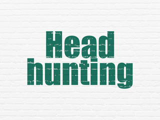 Finance concept: Head Hunting on wall background