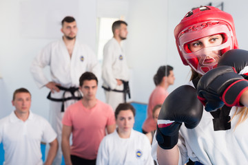 Portrait of  a girl during sparring in a taekwondo training