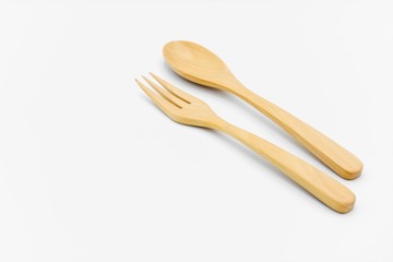 Wooden spoon and fork isolated on white background