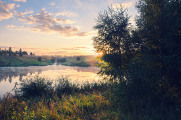 Sunny summer morning,Foggy landscape with river.River Krasivaya in Tula region,Russia.