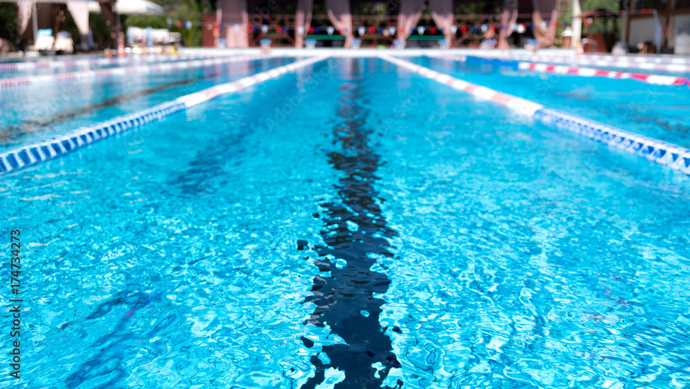 Wall mural lane swimming pool. closeup of the row of lanes in the swimming pool