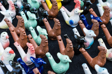 handmade clay whistles in a shape of birds