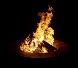 Isolated bonfire at night at a beach