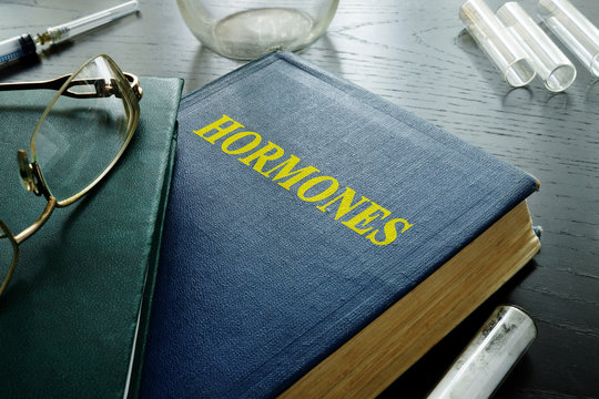 Book With Title Hormones On A Desk.