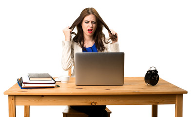 Frustrated business woman working with her laptop