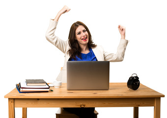 Lucky business woman working with her laptop