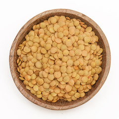 Brown lentils in the wooden bowl