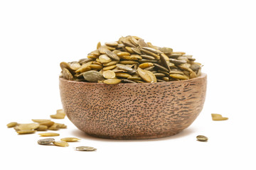 Pumpkin seeds in the wooden bowl