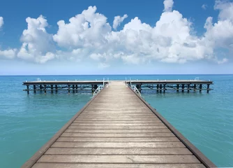 Fotobehang Perspective view of a wooden pier © AlenKadr