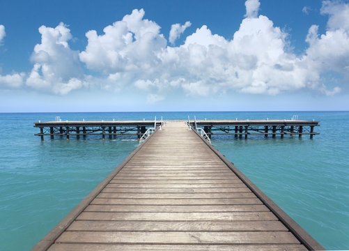 Fototapeta Perspective view of a wooden pier