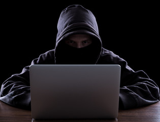 Anonymous hacker in the dark