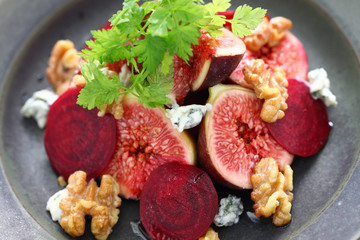 fresh salad with figs, beets, walnuts and roquefort cheese