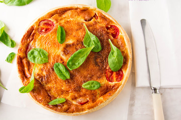 Homemade Cheesy Egg Quiche for Brunch with Spinach and Tomato