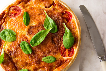 Homemade Cheesy Egg Quiche for Brunch with Spinach and Tomato