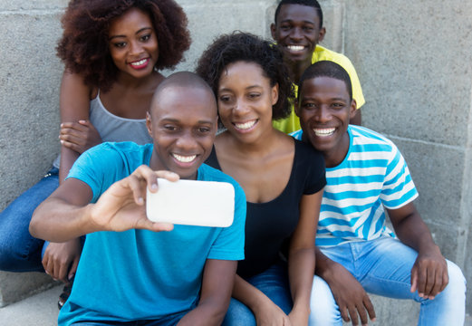 Group of five african american men and woman taking selfie