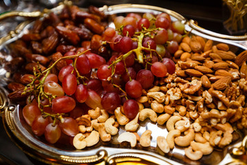 Grapes and nuts on a tray