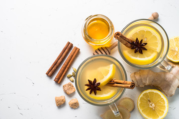Fototapeta na wymiar Hot Ginger tea with lemon, honey and spices.