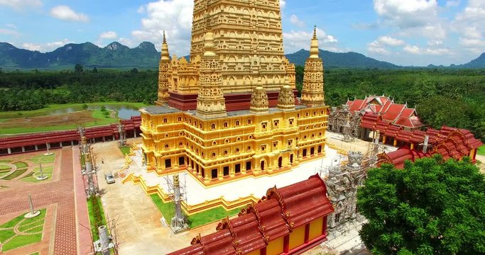scenic view the tiered golden pagoda at Bang Tong temple
aerial photography the highest golden pagoda in Thailand at Bang Tong temple Krabi province south of Thailand