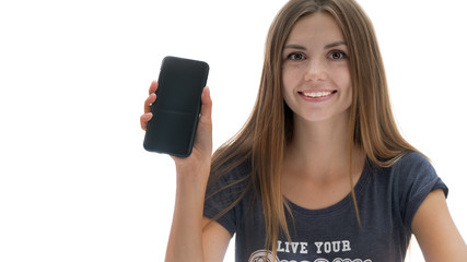 A nice girl is holding a smartphone in her hand